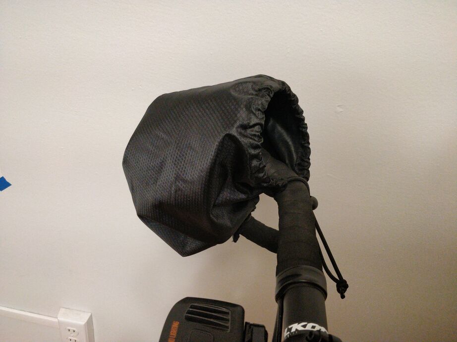 Photo of a pogie installed on drop handlebars
